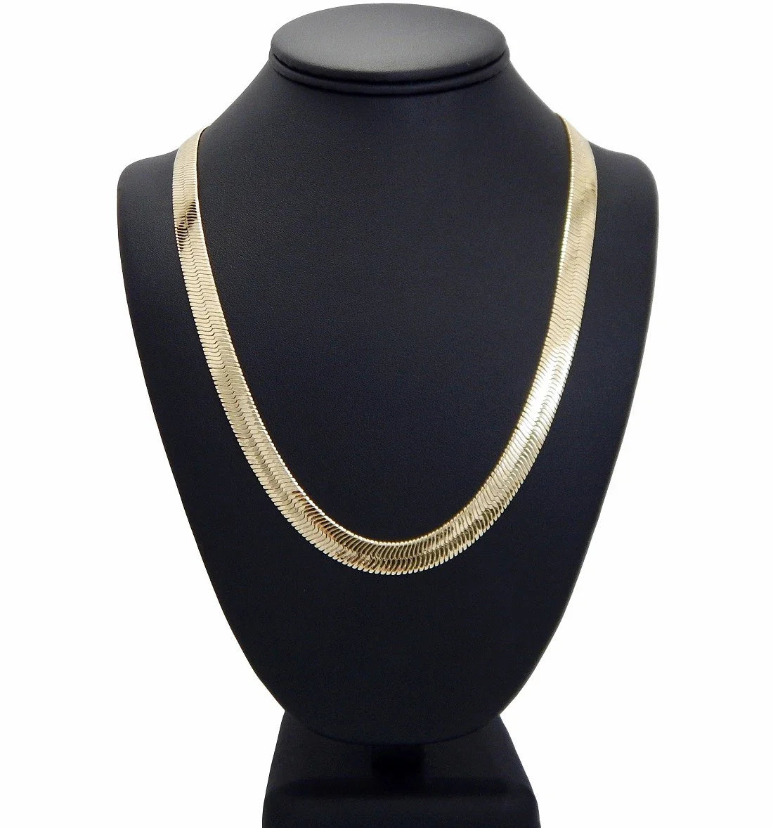 Herringbone necklace on black model bust in front of a white background