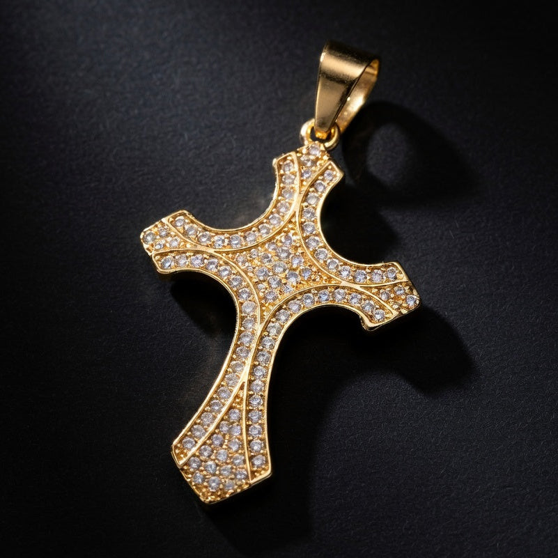 golden gem studded crucifix on black background