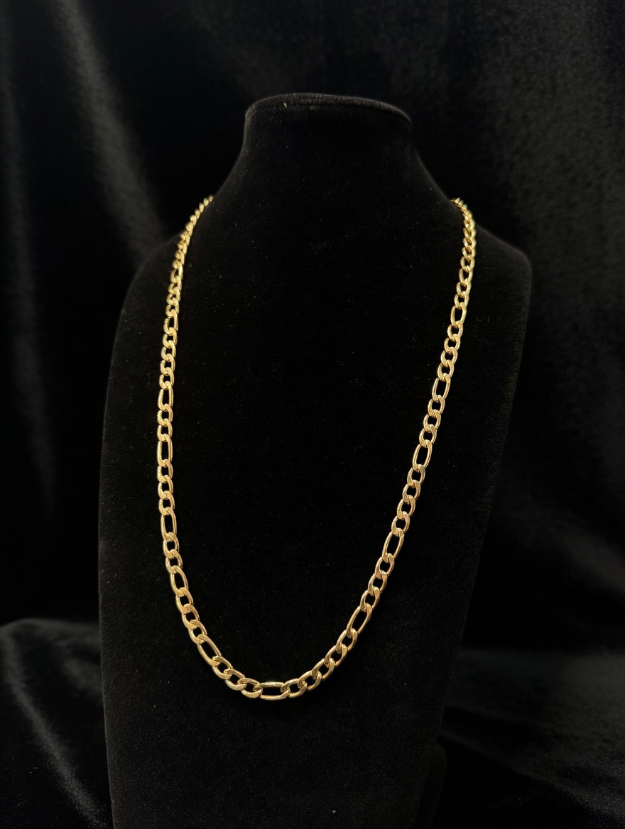 Figaro chain on a black bust in a black room background
