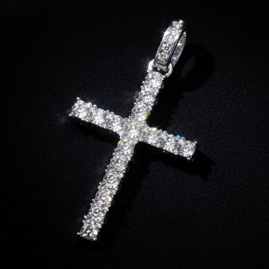 Silver cross pendant with clear stones on a black background