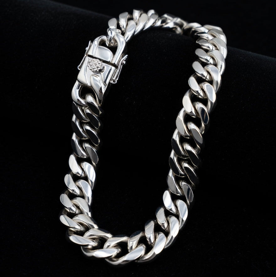Silver chain bracelet on a black background