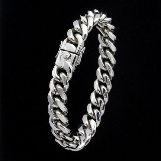 Silver chain bracelet on a black background