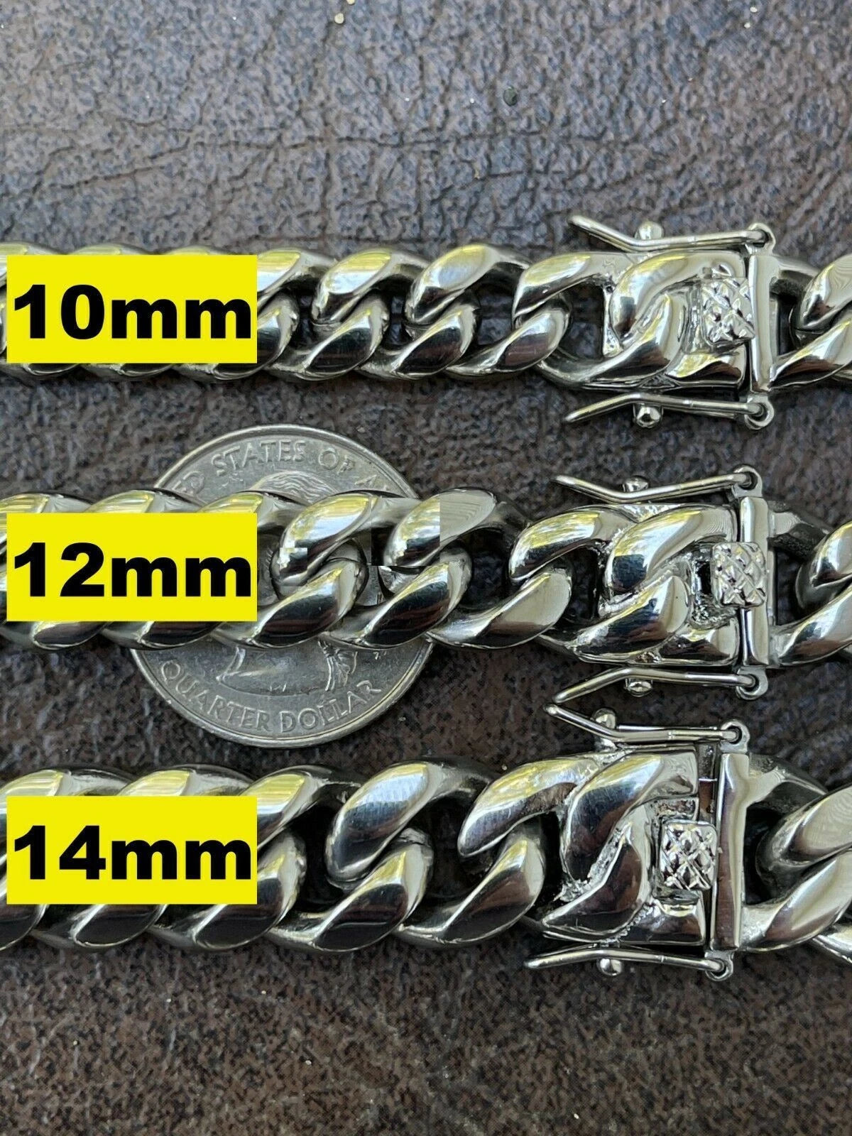 Silver chain bracelet with measurements in millimeters on a textured surface