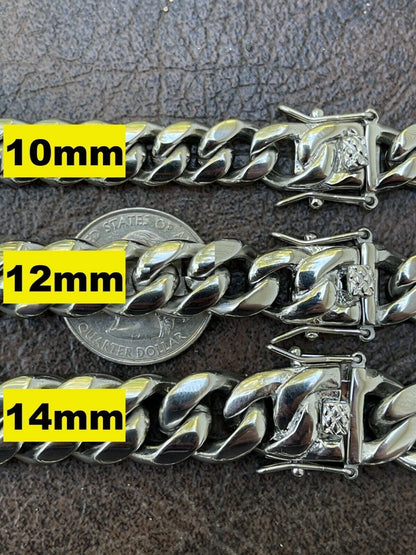 Silver chain bracelet with measurements in millimeters on a textured surface