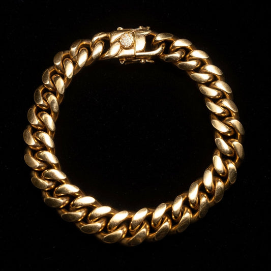 Gold Miami cuban chain bracelet on a black background